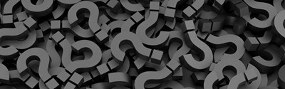 An image of a pile of question marks to represent Frequently Asked Questions About How Neurofeedback Works 