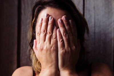 A person crying who is struggling with depression, who hasn't learned about treating depression without medication.
